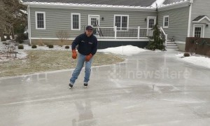 Who says the polar vortex isn't fun? Man skates on his frozen driveway