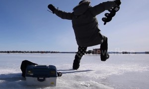 This is the moment an ice fisherman finds out ice is slippery