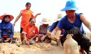 Superstitious villagers drink and bathe in mud they believe has special powers