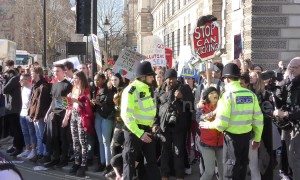 Schoolchildren stage sit-down protest outside UK Houses of Parliament