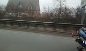 UFO Car Driving down Highway