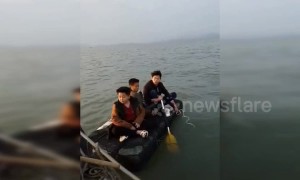 Boys adrift at sea on paddle-board rescued by police