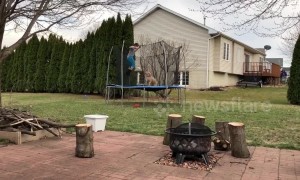 Iowa boy and his dog love jumping on the trampoline together