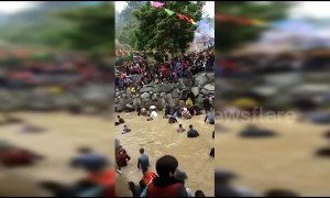 Thousands catch fish with bare hands at annual festival in China’s Fujian