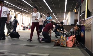 Awkward moment as man receives foot massage from woman in busy Thai airport