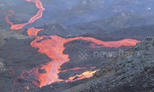 Brave hiker captures rivers of lava erupting from volcano on French-controlled island