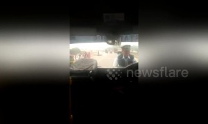 Driver drags traffic policeman on car bonnet after being caught illegally parking