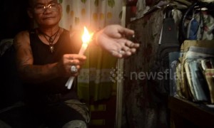 Filipino man coats arm in hot wax in bizarre ritual