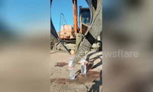 Smooth operator! Digger driver shows off his precision machinery control