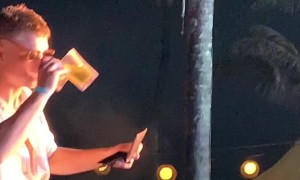 Guy Tries to Record Concert with Wallet