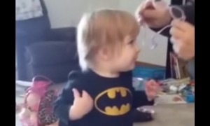 Toddler's reaction after clearly seeing parents for first time with glasses