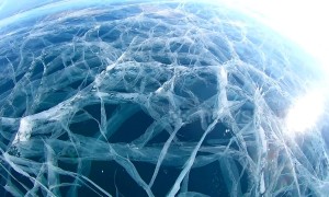 Hypnotic labyrinth of ice tunnels stuns visitors at world's deepest lake