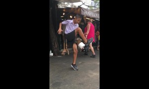 Thai boy shows off soccer skills with toilet roll street performance