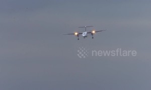Roller coaster ride! Tiny turboprop plane buffeted by high winds in aborted Dusseldorf landing