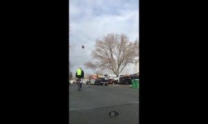 Man kicks football then catches the shot in a backpack