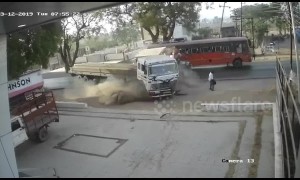 Pedestrian has near-miss after being caught in deadly smash between lorry and pickup