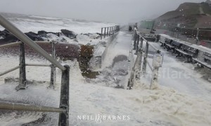 Sea foam froths into wind as Storm Gareth strikes Dorset