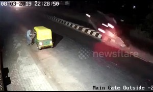 Car goes flying off road divider and bursts into flames in west India