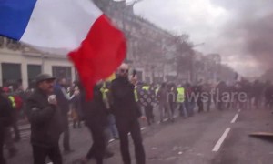 Violent Yellow Vest protests continue in Paris with clashes with police