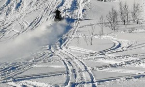 Snowmobile Tries to Climb Super Steep Hill