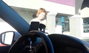 Woman Crosses Street Wearing Towel