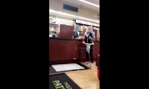 Woman drops bottle of wine in US shop