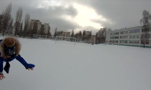 Dad Launches Kid into the Snow