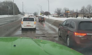 Wrecked Road Riddled with Problematic Potholes