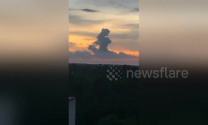 Cloud shaped like a girl seen floating above horizon in China