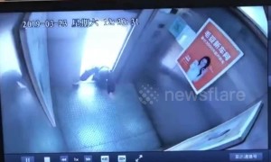 Old Chinese woman narrowly escapes death climbing out of malfunctioning elevator