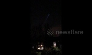 Police helicopters circle over suspected burglars standing on northwest London roof