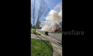 Burning Cadillac rolls down road and crashes into house in Tennessee