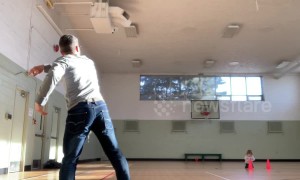 Canadian dad sinks amazing trick shot by throwing a rugby ball through basketball hoop