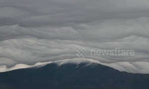 Bizarre 'sheet-like' clouds seen rolling over Mount Etna