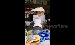 Kung fu master shows off Tai Chi moves while spinning roti pirata dough