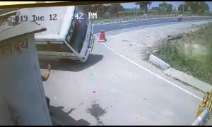 Stunning moment SUV crashes into bus and flips it over on Indian road