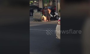 Children bathe in leaking water pipe in drought-hit Philippines