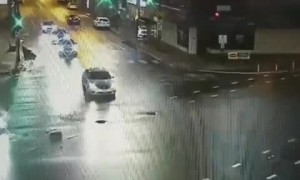 Drunk driver runs red light, hits police car