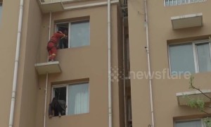 Fireman kicks suicidal girl back to safety in China’s Hebei