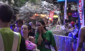 Thousands of tourists take part in 'world's biggest water fight' despite government ban