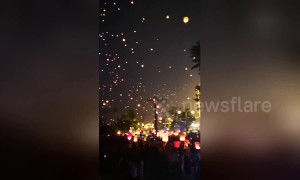 Thousands of lanterns fly into sky to celebrate New Year of China's Dai ethnic group