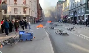 Angry demonstrators light fires on streets of Copenhagen