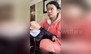 Mum pretends to watch TV to avoid being caught eating by greedy son