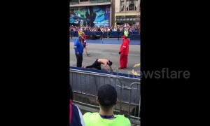 Marine running in honour of fallen comrades crawls to Boston Marathon finish line