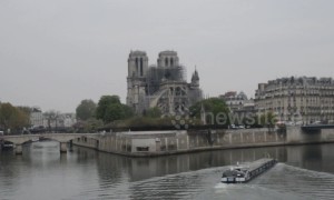 Media and tourists gather at Notre Dame on morning after fire