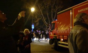 Parisians applaud firefighters following Notre Dame fire
