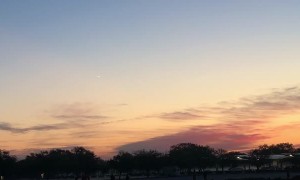 Meteor Streaks Across Sunrise Sky