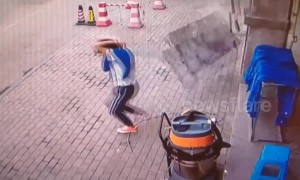 Chinese man has lucky escape avoiding falling marble blocks