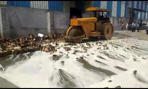 Indian authorities steam-roller more than 11,000 cans of expired beer