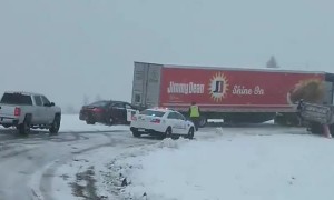 State Trooper Pushes Semi Stuck in Snow